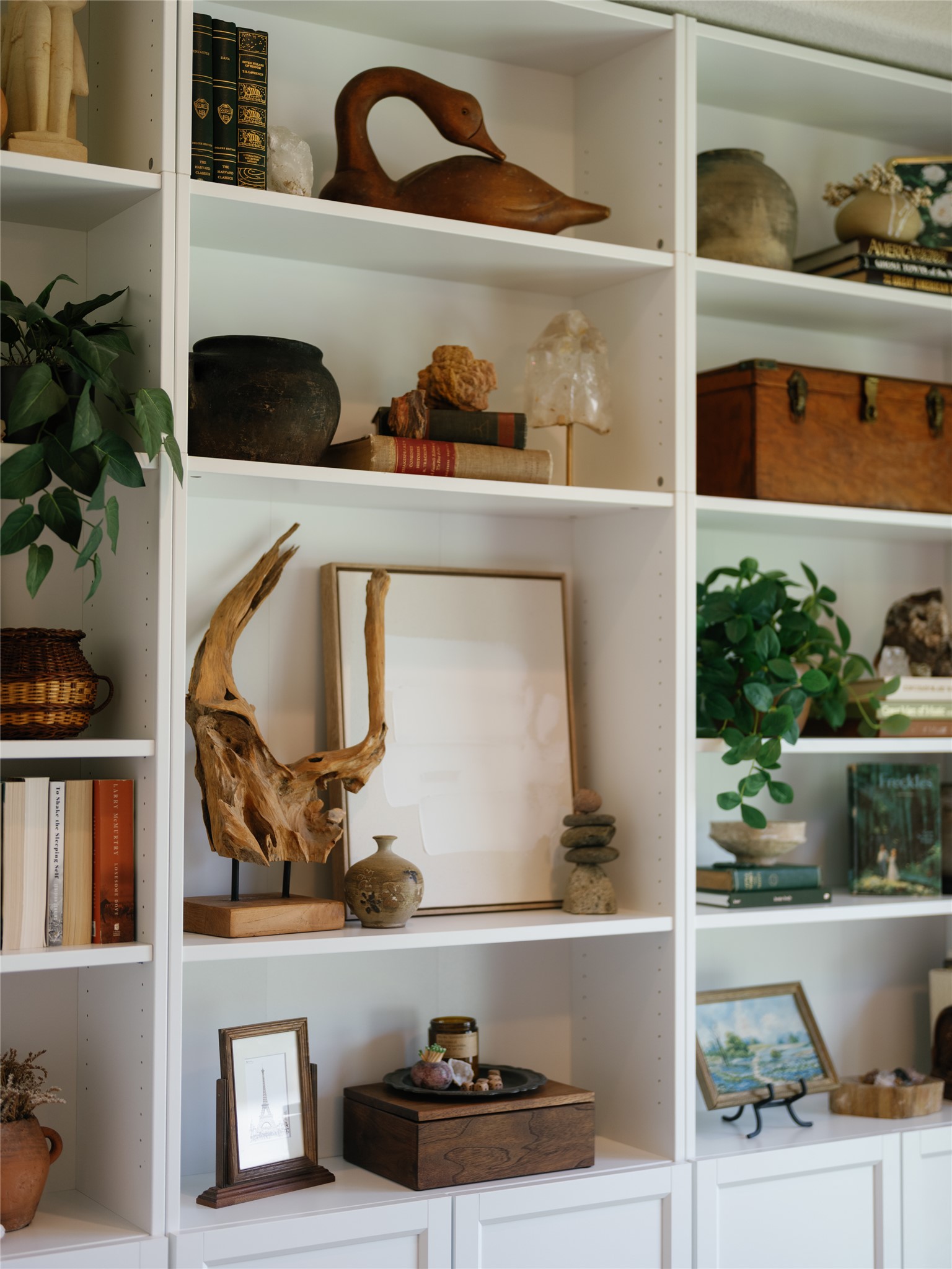 145 Eagle Pass Trail Georgetown, TX 78628 - Photo 12 of 37 Integrated wall shelving offers abundant display space, ideal for showcasing curated decor and literary collections.