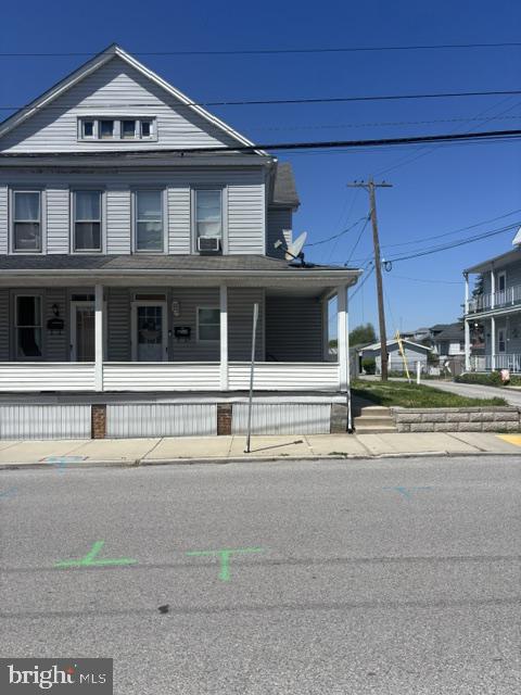 Charming duplex with inviting porch.