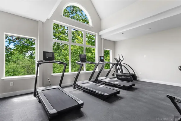 a kitchen with a stove top oven and refrigerator