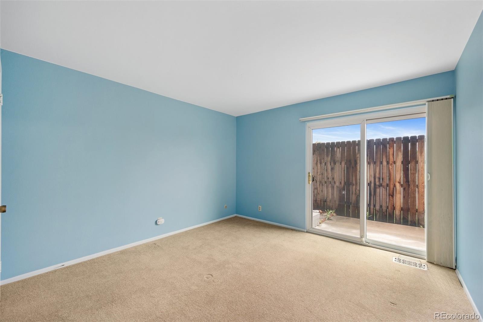 6495 East Happy Canyon Road, Unit 171 Denver, CO 80237 - Photo 12 of 27 a view of an empty room with glass door