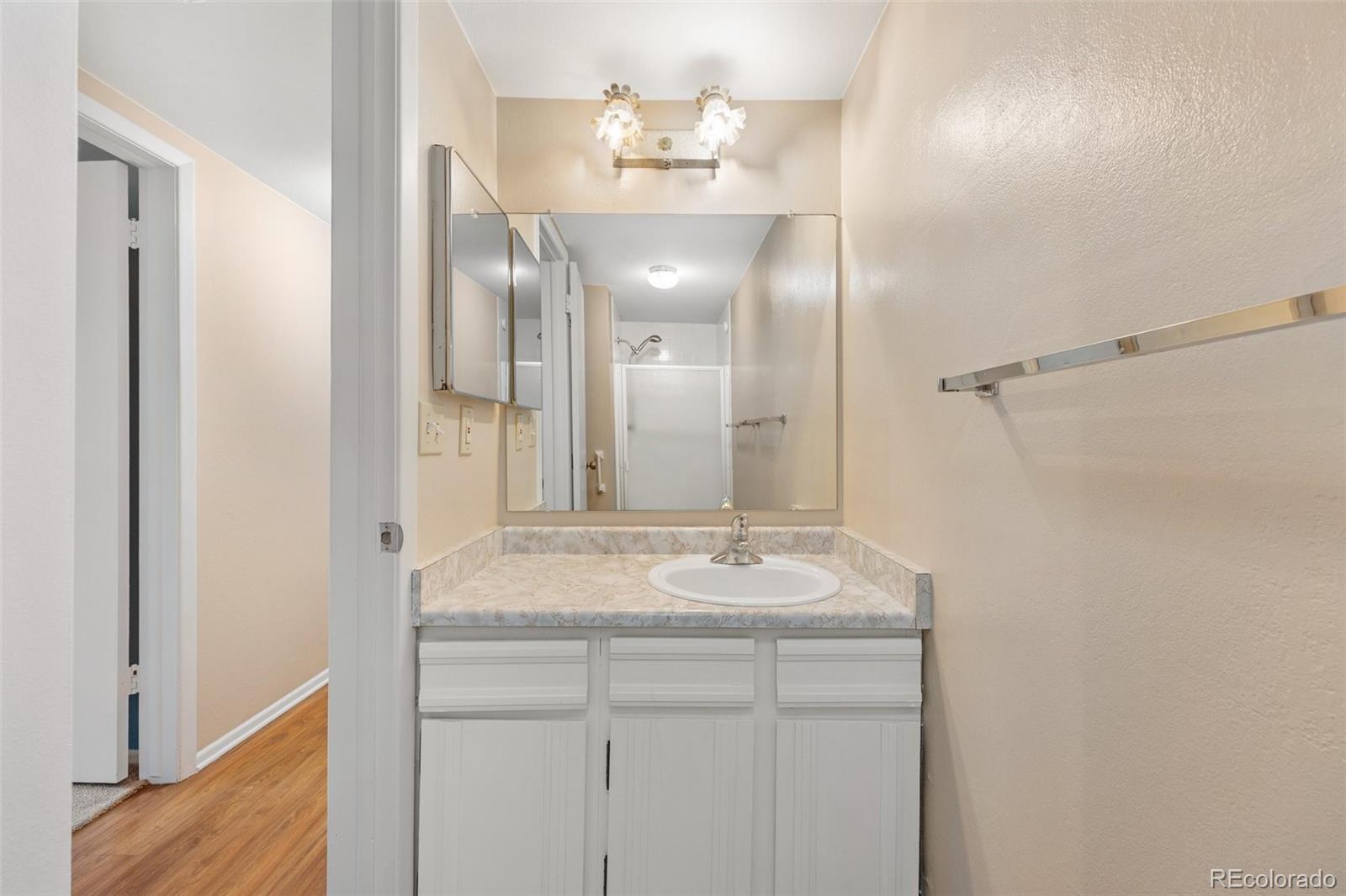 6495 East Happy Canyon Road, Unit 171 Denver, CO 80237 - Photo 13 of 27 a bathroom with a sink and a mirror