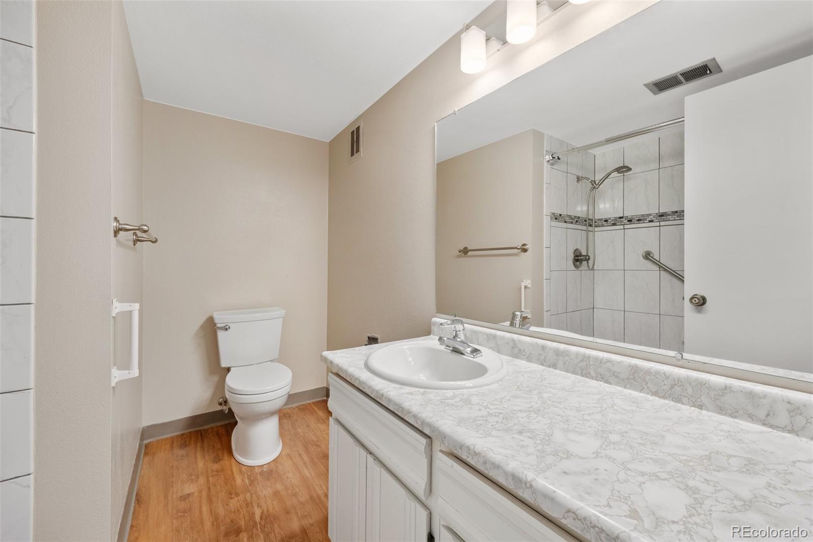 6495 East Happy Canyon Road, Unit 171 Denver, CO 80237 - Photo 17 of 27 a bathroom with a sink and a mirror
