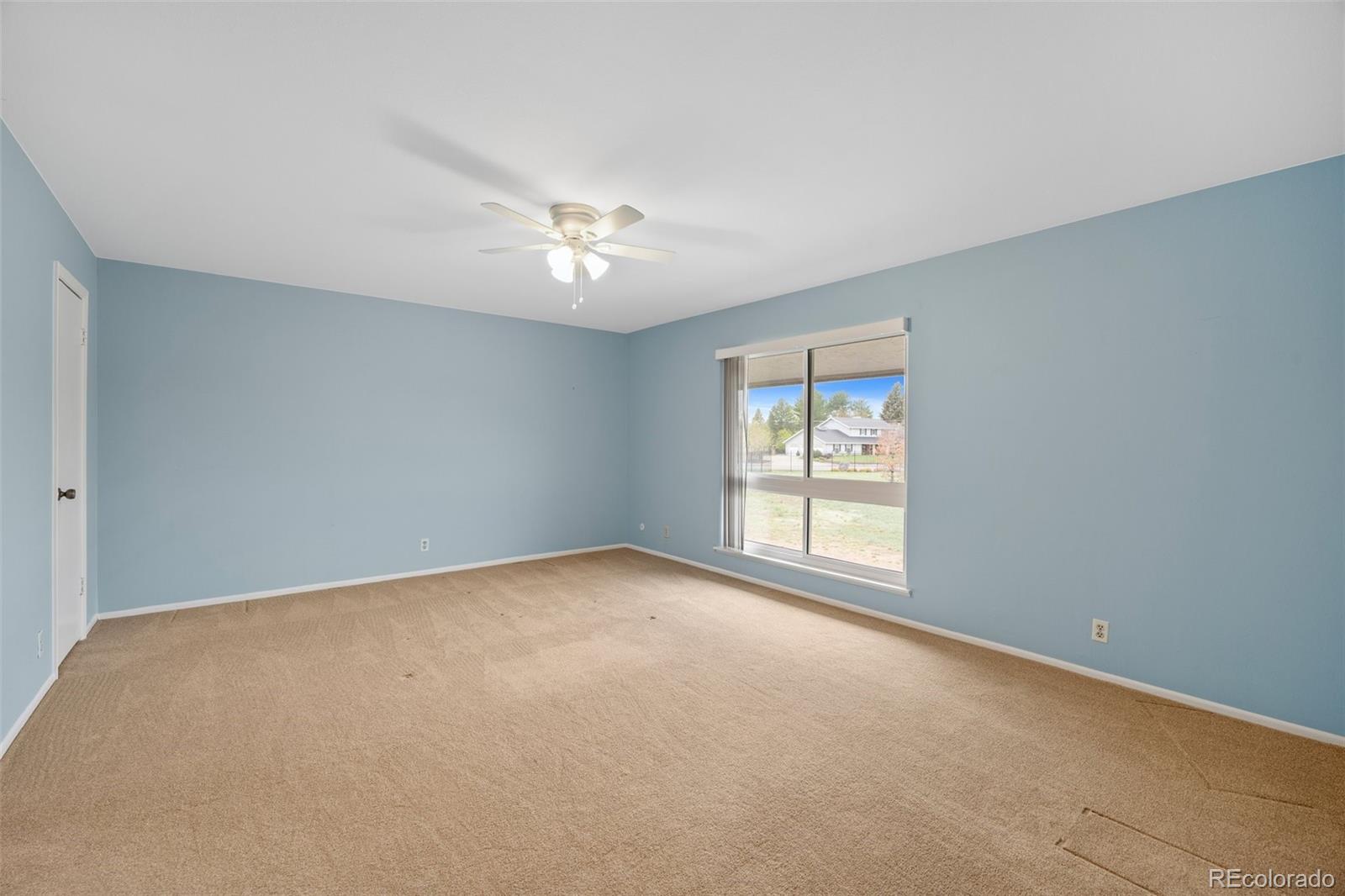 6495 East Happy Canyon Road, Unit 171 Denver, CO 80237 - Photo 18 of 27 a view of an empty room with a window