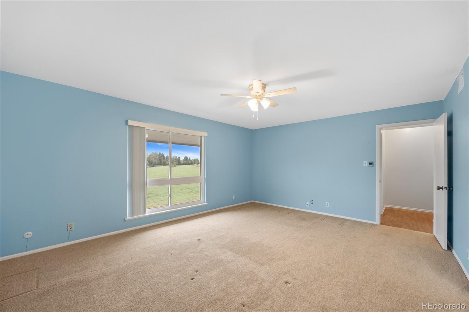 6495 East Happy Canyon Road, Unit 171 Denver, CO 80237 - Photo 21 of 27 a view of an empty room with a window