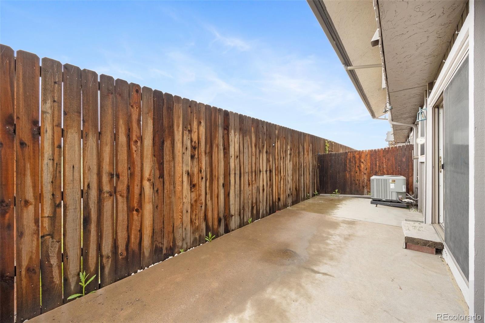 6495 East Happy Canyon Road, Unit 171 Denver, CO 80237 - Photo 24 of 27 a view of a backyard with wooden fence