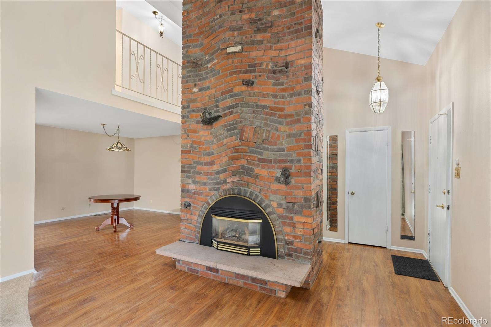 6495 East Happy Canyon Road, Unit 171 Denver, CO 80237 - Photo 3 of 27 a living room with furniture and a fireplace