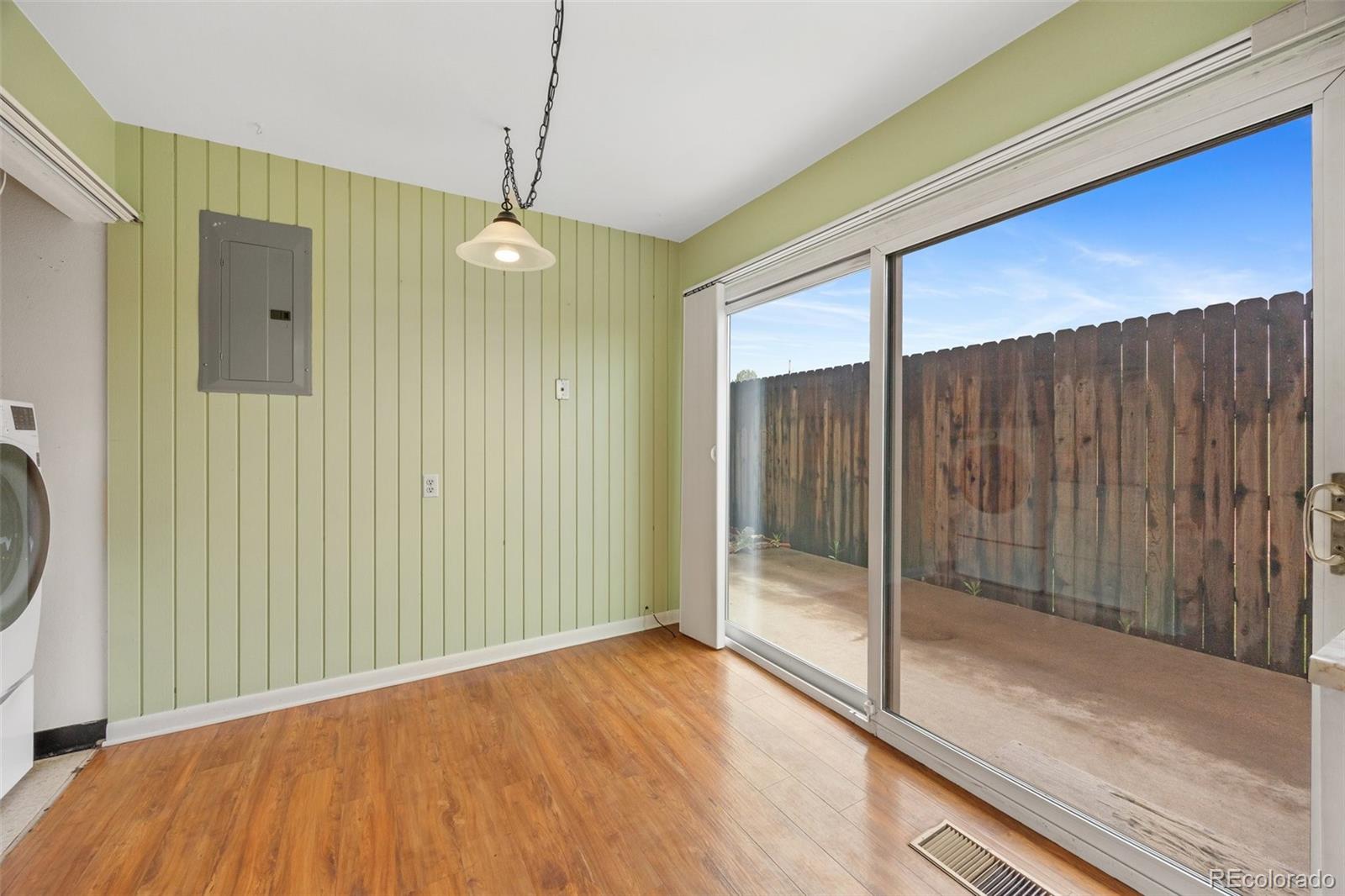 6495 East Happy Canyon Road, Unit 171 Denver, CO 80237 - Photo 9 of 27 a view of a room with wooden floor and window