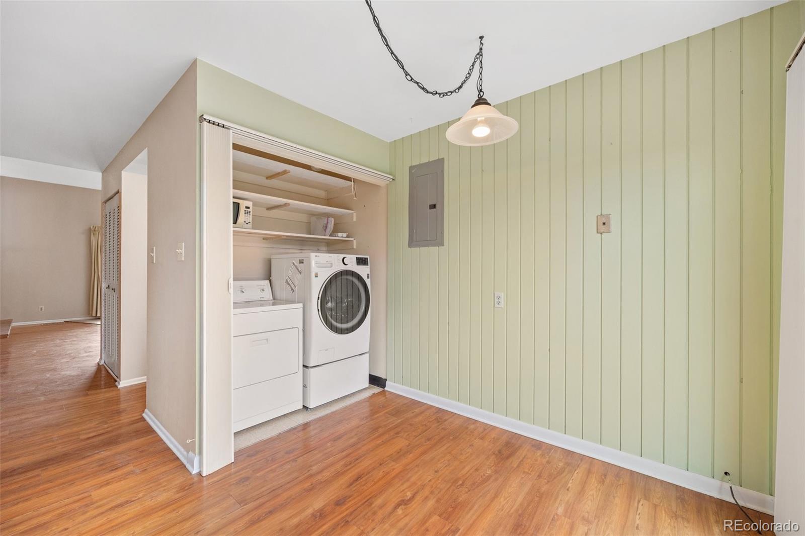 6495 East Happy Canyon Road, Unit 171 Denver, CO 80237 - Photo 10 of 27 a view of a storage & utility room with wooden floor