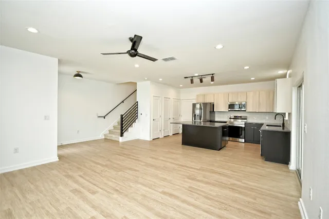 a view of kitchen with wooden floor