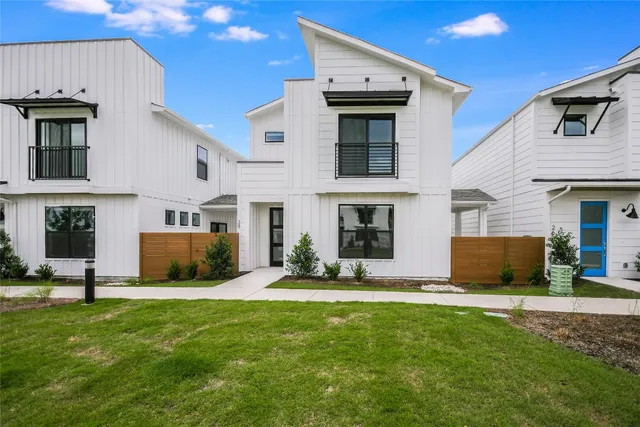 a view of a house with a yard and a fireplace