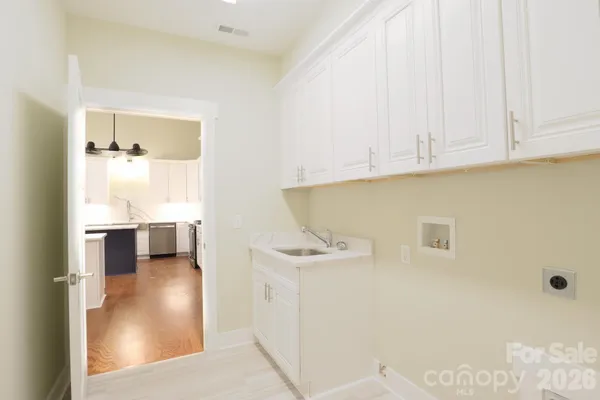 a view of kitchen and utility room