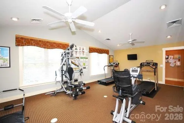 a view of house with outdoor space and seating area