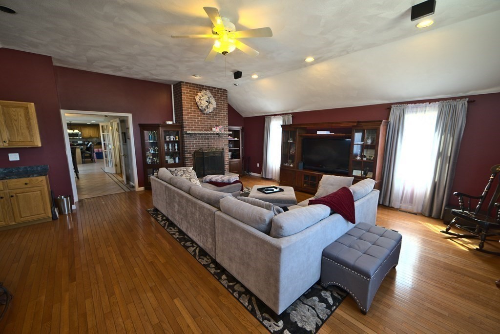 8 Sparrow Road Stoughton, MA 02072 - Photo 13 of 28 a living room with furniture and a flat screen tv
