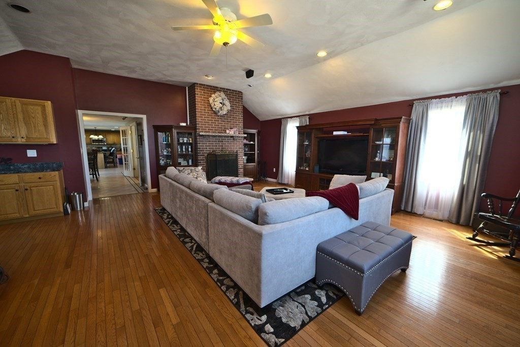 8 Sparrow Road Stoughton, MA 02072 - Photo 14 of 28 a living room with furniture and a wooden floor