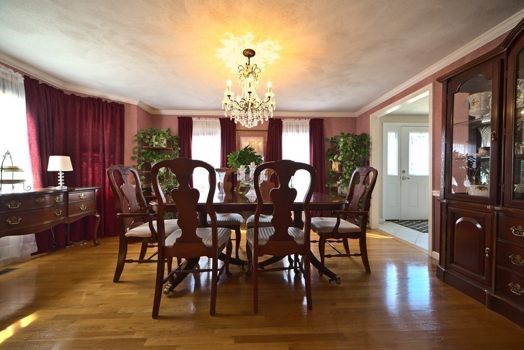 8 Sparrow Road Stoughton, MA 02072 - Photo 16 of 28 a view of a dining room with furniture window and wooden floor