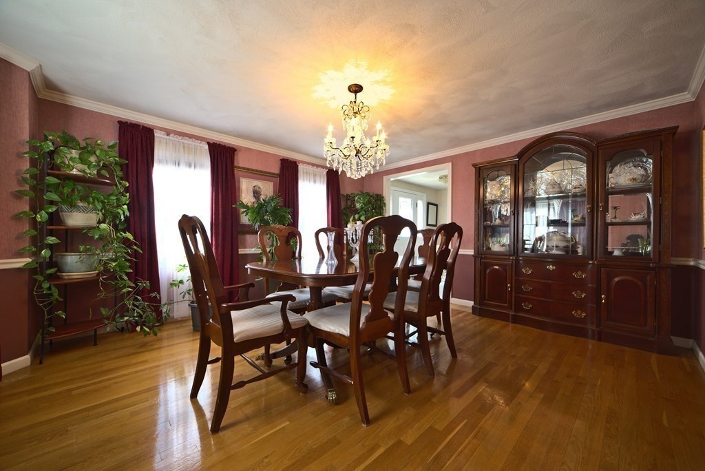 8 Sparrow Road Stoughton, MA 02072 - Photo 17 of 28 a view of a dining room with furniture and chandelier