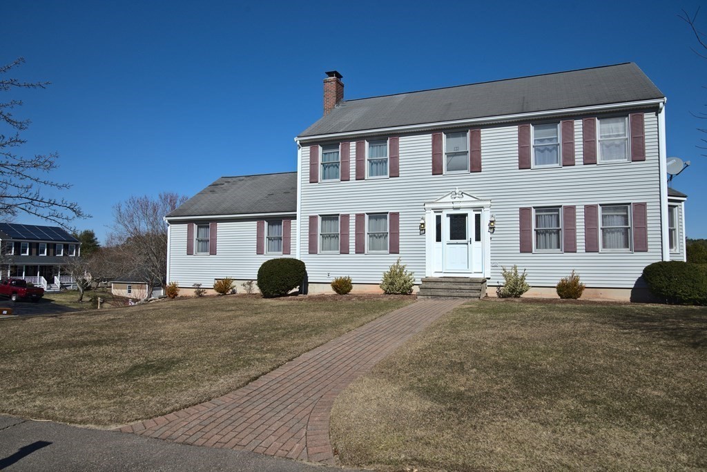 8 Sparrow Road Stoughton, MA 02072 - Photo 2 of 28 a front view of a house with a yard