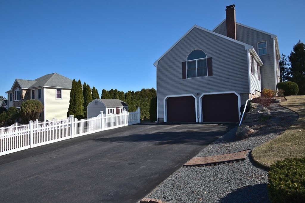 8 Sparrow Road Stoughton, MA 02072 - Photo 3 of 28 a front view of a house with a yard