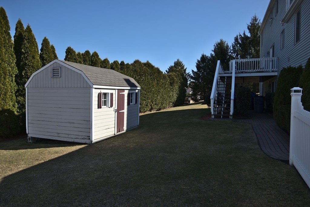 8 Sparrow Road Stoughton, MA 02072 - Photo 6 of 28 a front view of a house with a yard