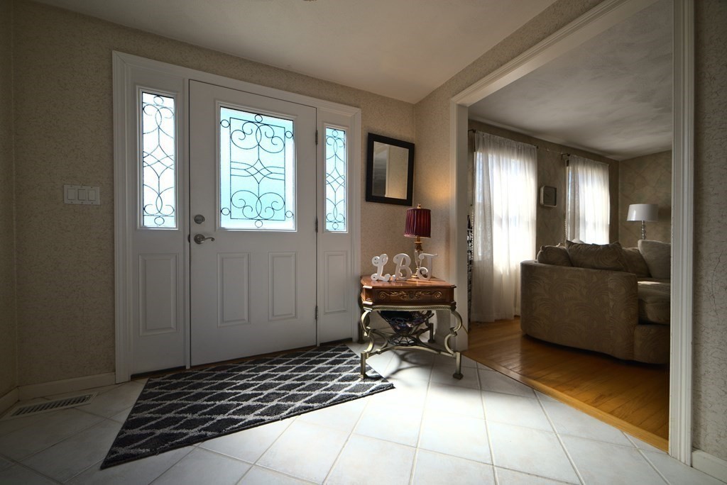 8 Sparrow Road Stoughton, MA 02072 - Photo 7 of 28 a living room with furniture and a window