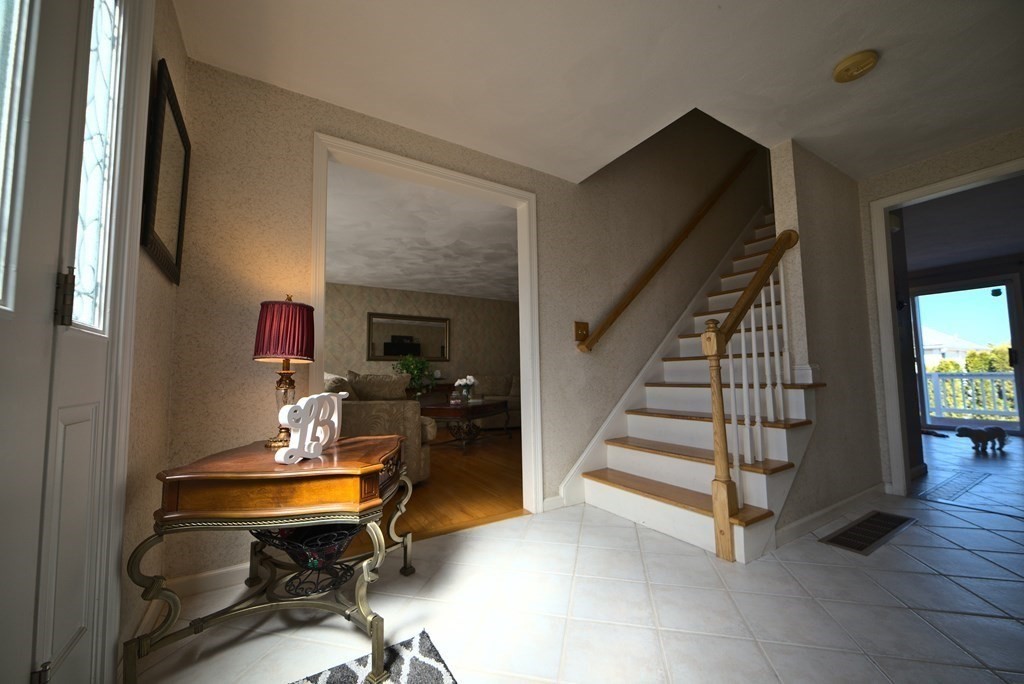 8 Sparrow Road Stoughton, MA 02072 - Photo 8 of 28 a view of entryway livingroom and hall with wooden floor