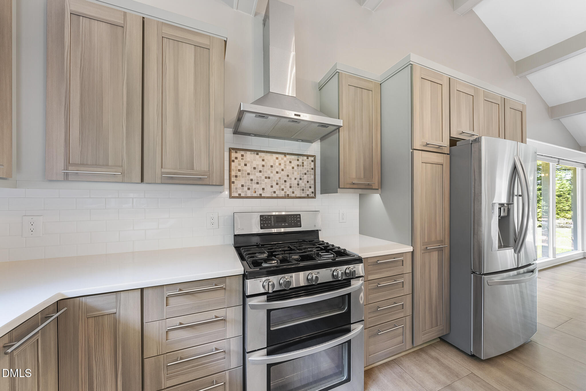 1605 Ridge Road Raleigh, NC 27607 - Photo 14 of 34 a kitchen with stainless steel appliances a refrigerator stove and sink