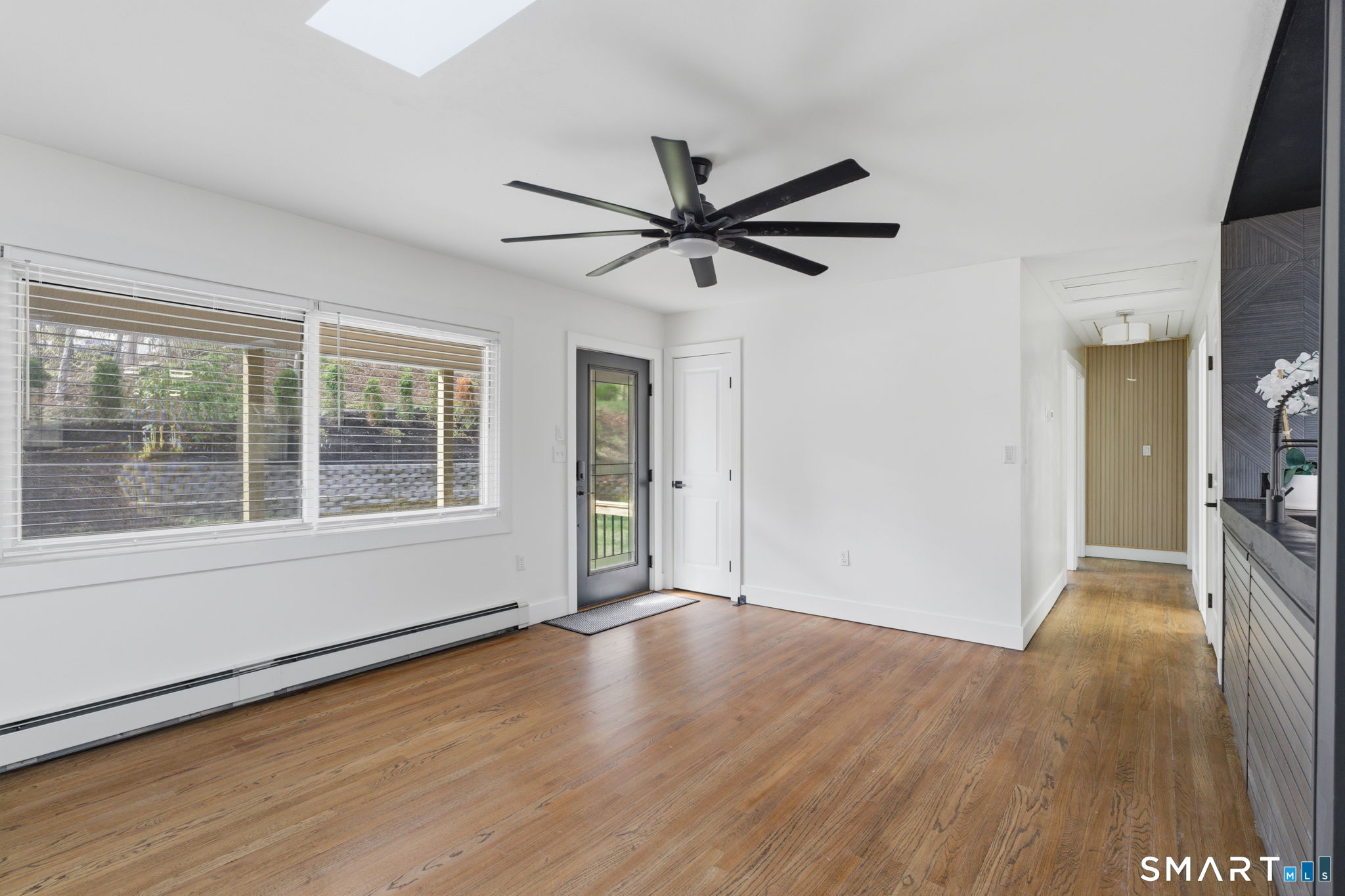 16 Beverly Road East Lyme, CT 06357 - Photo 14 of 40 a view of empty room with wooden floor and fan
