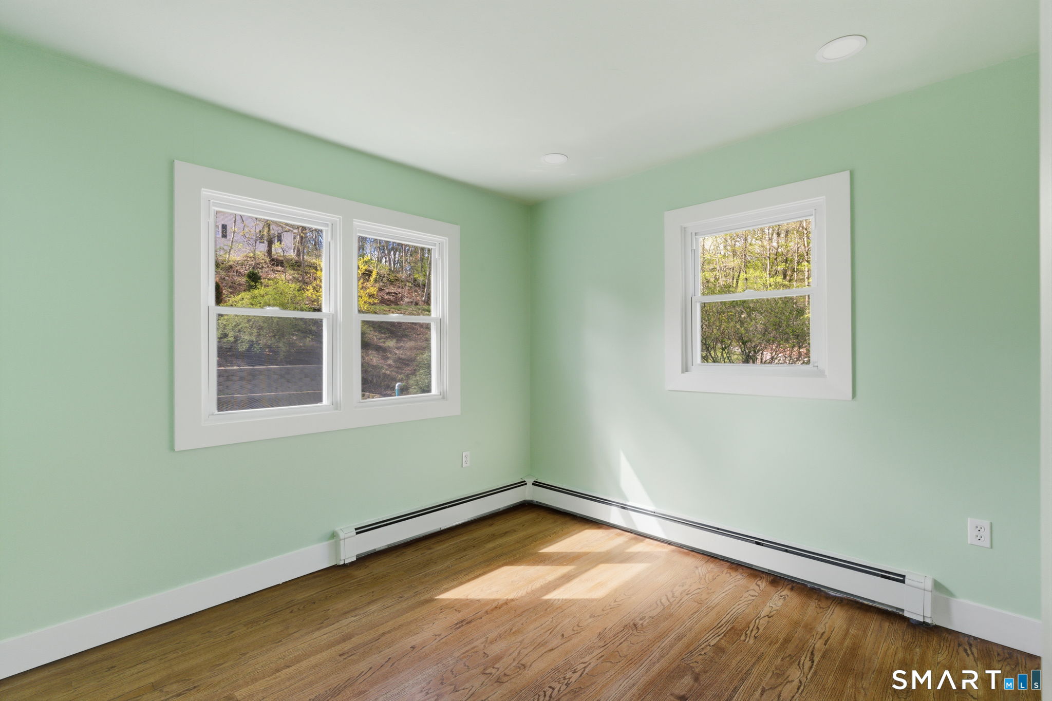 16 Beverly Road East Lyme, CT 06357 - Photo 26 of 40 a view of an empty room with wooden floor and a window