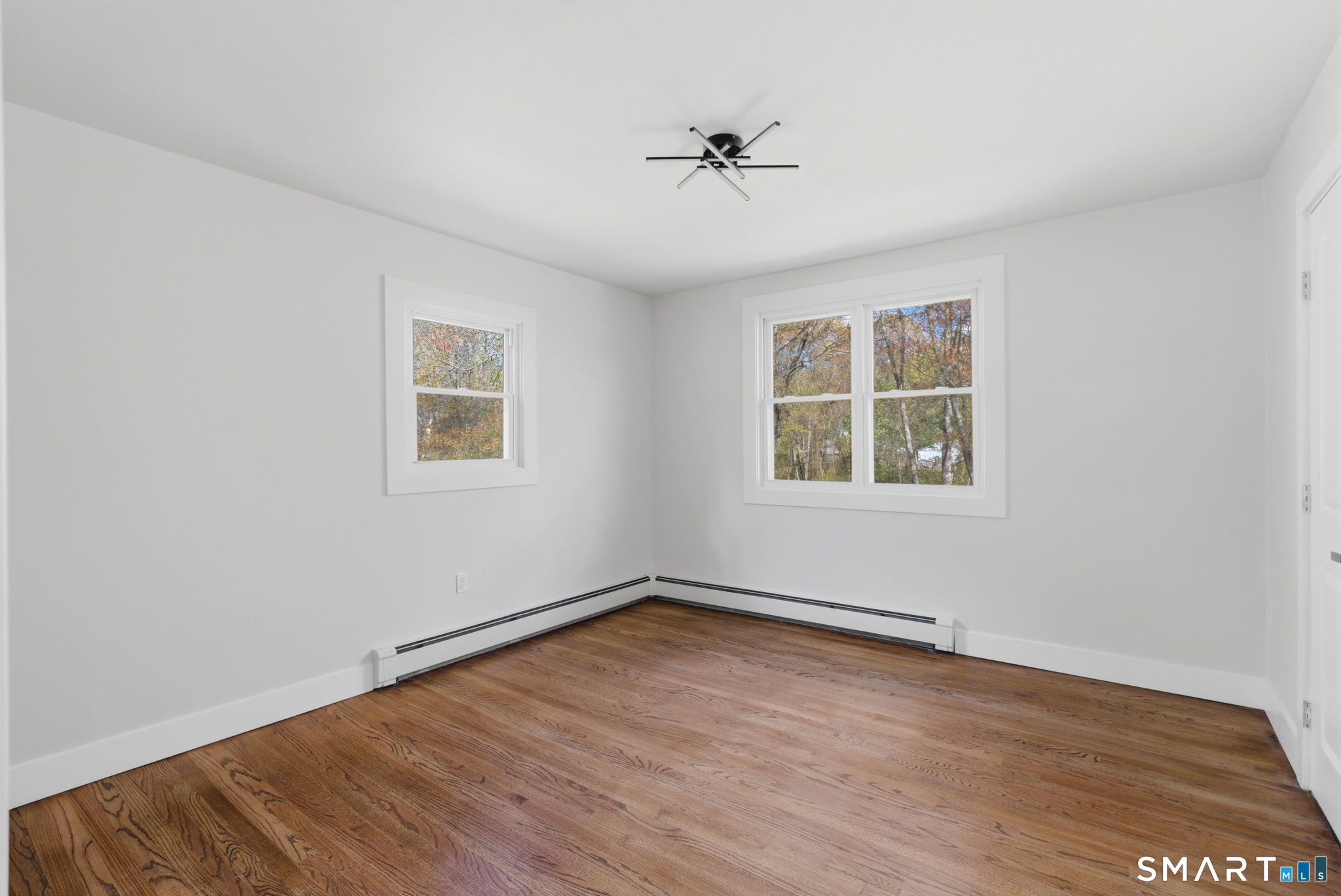 16 Beverly Road East Lyme, CT 06357 - Photo 28 of 40 wooden floor in an empty room with a window