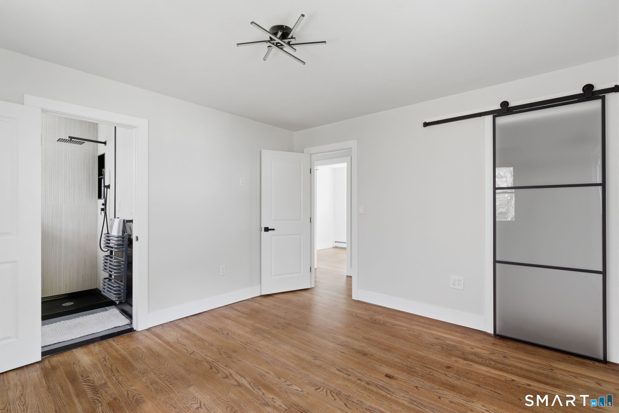 16 Beverly Road East Lyme, CT 06357 - Photo 29 of 40 a view of a room with wooden floor and a refrigerator