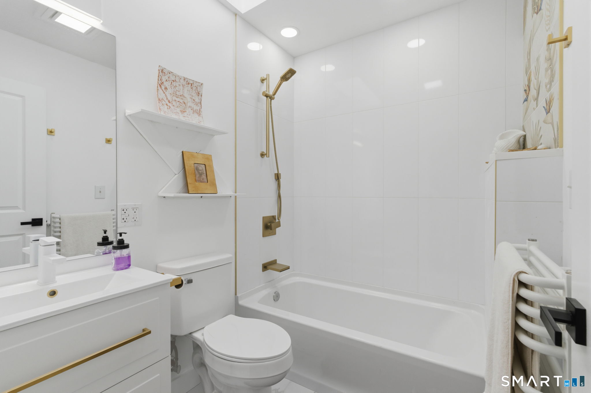 16 Beverly Road East Lyme, CT 06357 - Photo 34 of 40 a bathroom with a bathtub shower sink vanity mirror and toilet