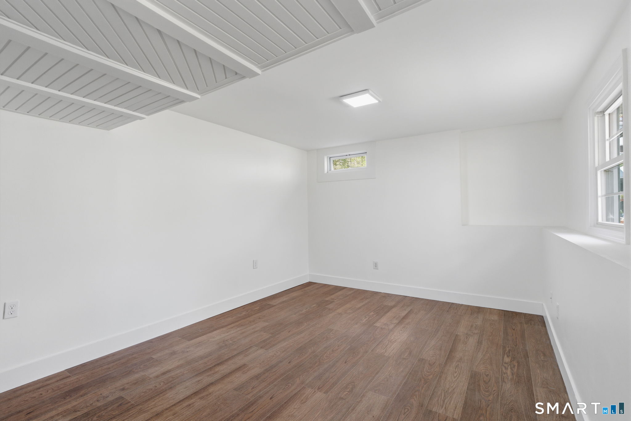 16 Beverly Road East Lyme, CT 06357 - Photo 39 of 40 a view of room with wooden floor and fan