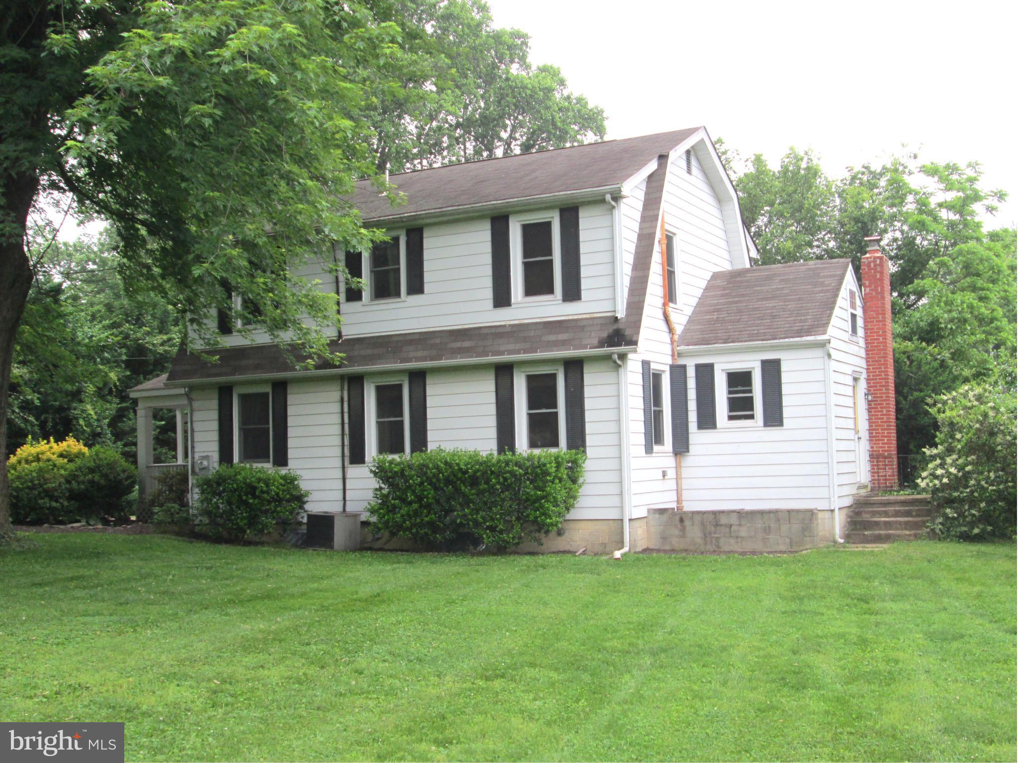 3061 Evans Road Riva, MD 21140 - Photo 2 of 22 a view of a house with a yard and plants