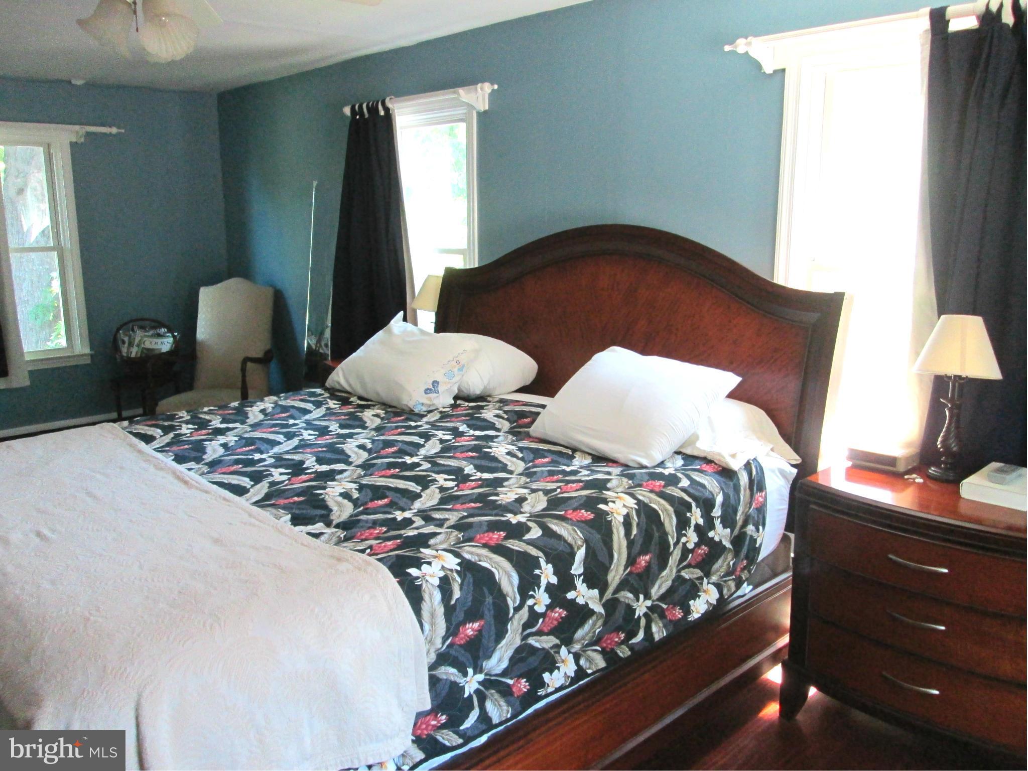 3061 Evans Road Riva, MD 21140 - Photo 11 of 22 a bedroom with a bed and a lamp