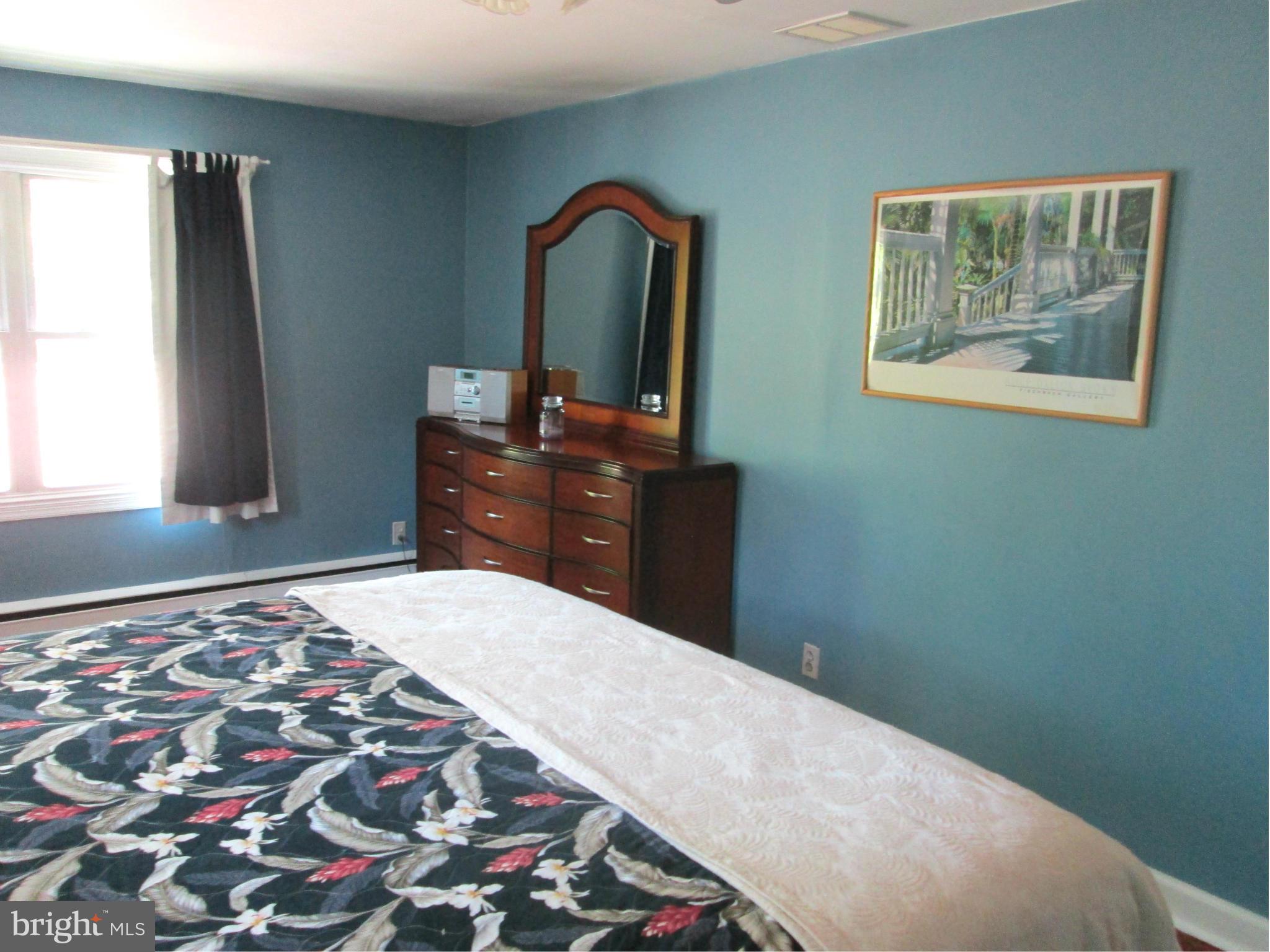 3061 Evans Road Riva, MD 21140 - Photo 12 of 22 a bedroom with a bed and a dresser