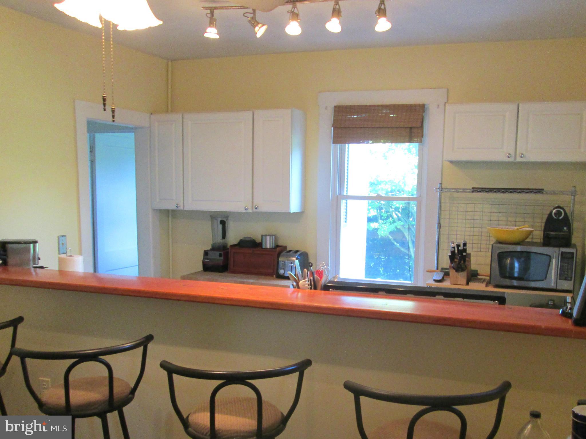 3061 Evans Road Riva, MD 21140 - Photo 5 of 22 a kitchen with a table chairs sink and cabinets