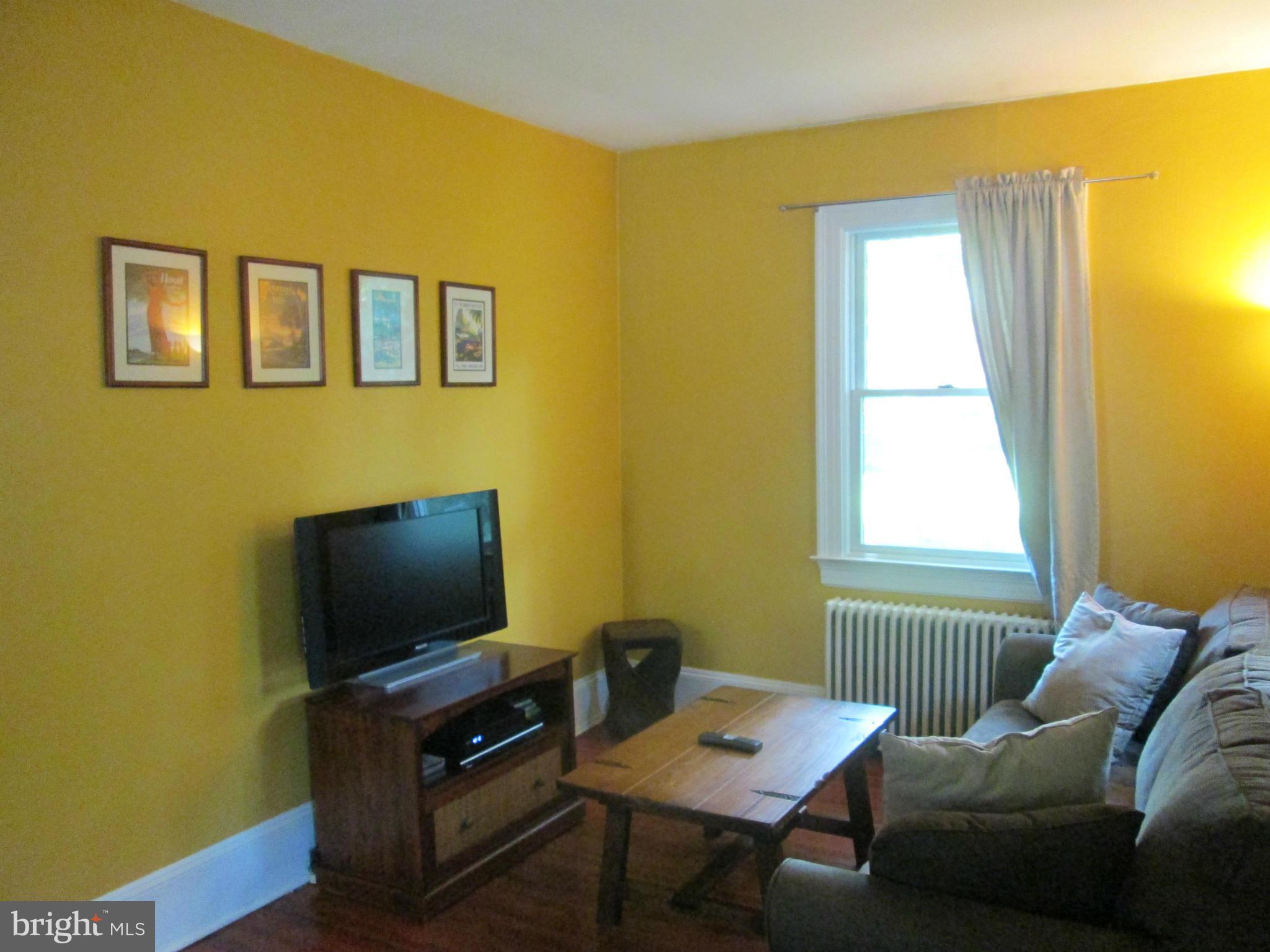 3061 Evans Road Riva, MD 21140 - Photo 6 of 22 a living room with furniture and a flat screen tv