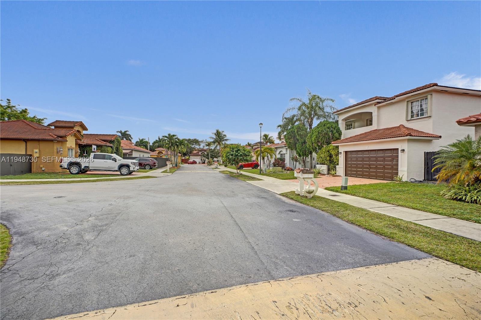 5502 Southwest 162nd Place Miami, FL 33185 - Photo 69 of 72 a front view of a house with a yard and garage