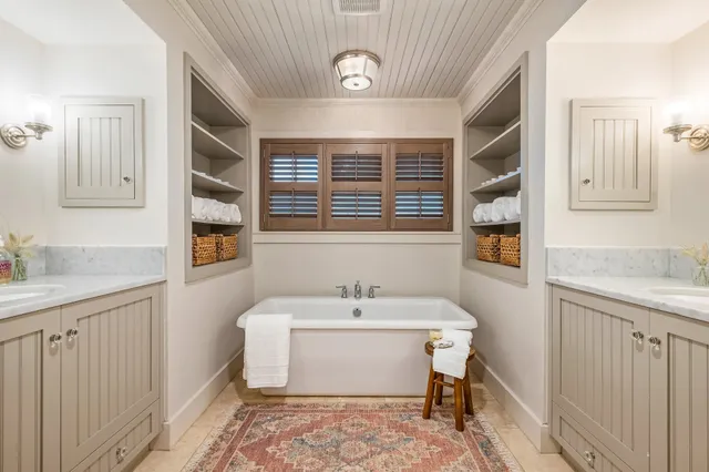 a bathroom with a sink and a window