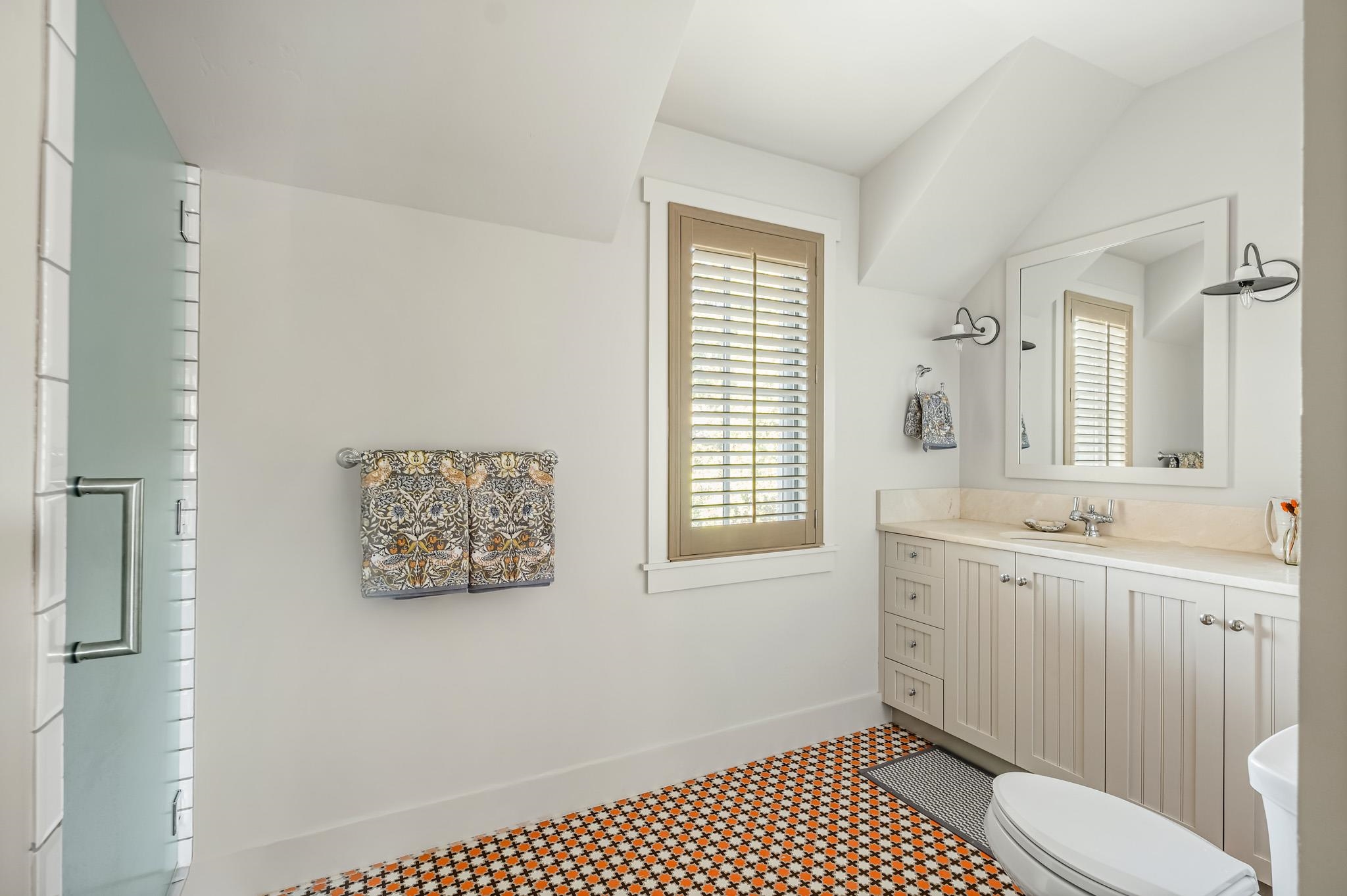 65 Riviera Cove Fredericksburg, TX 78624 - Photo 15 of 26 a bathroom with a sink a toilet and a window