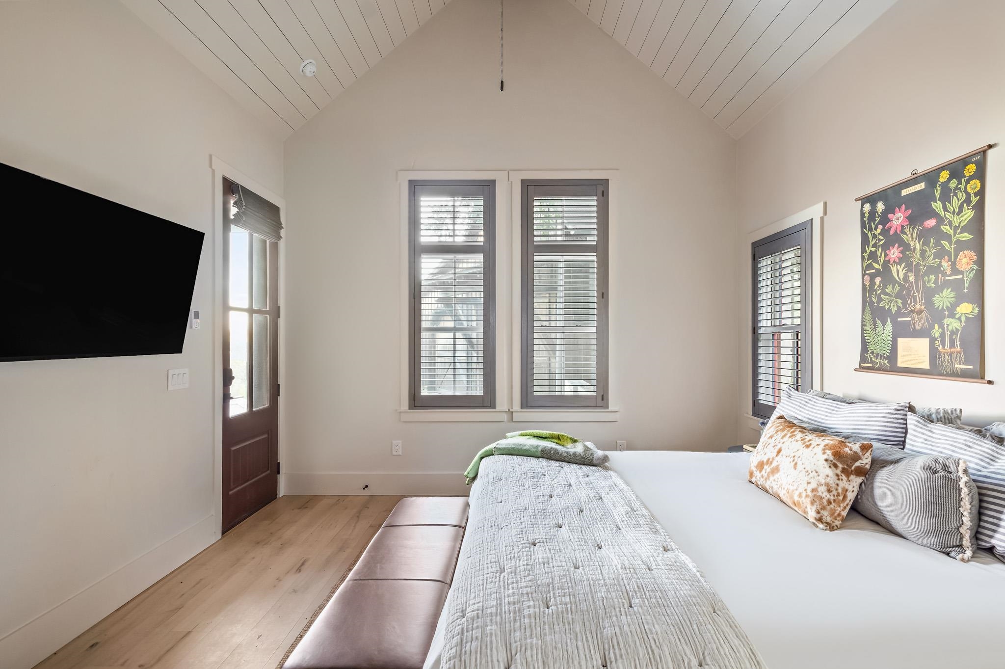 65 Riviera Cove Fredericksburg, TX 78624 - Photo 20 of 26 a bedroom with a bed and a flat screen tv