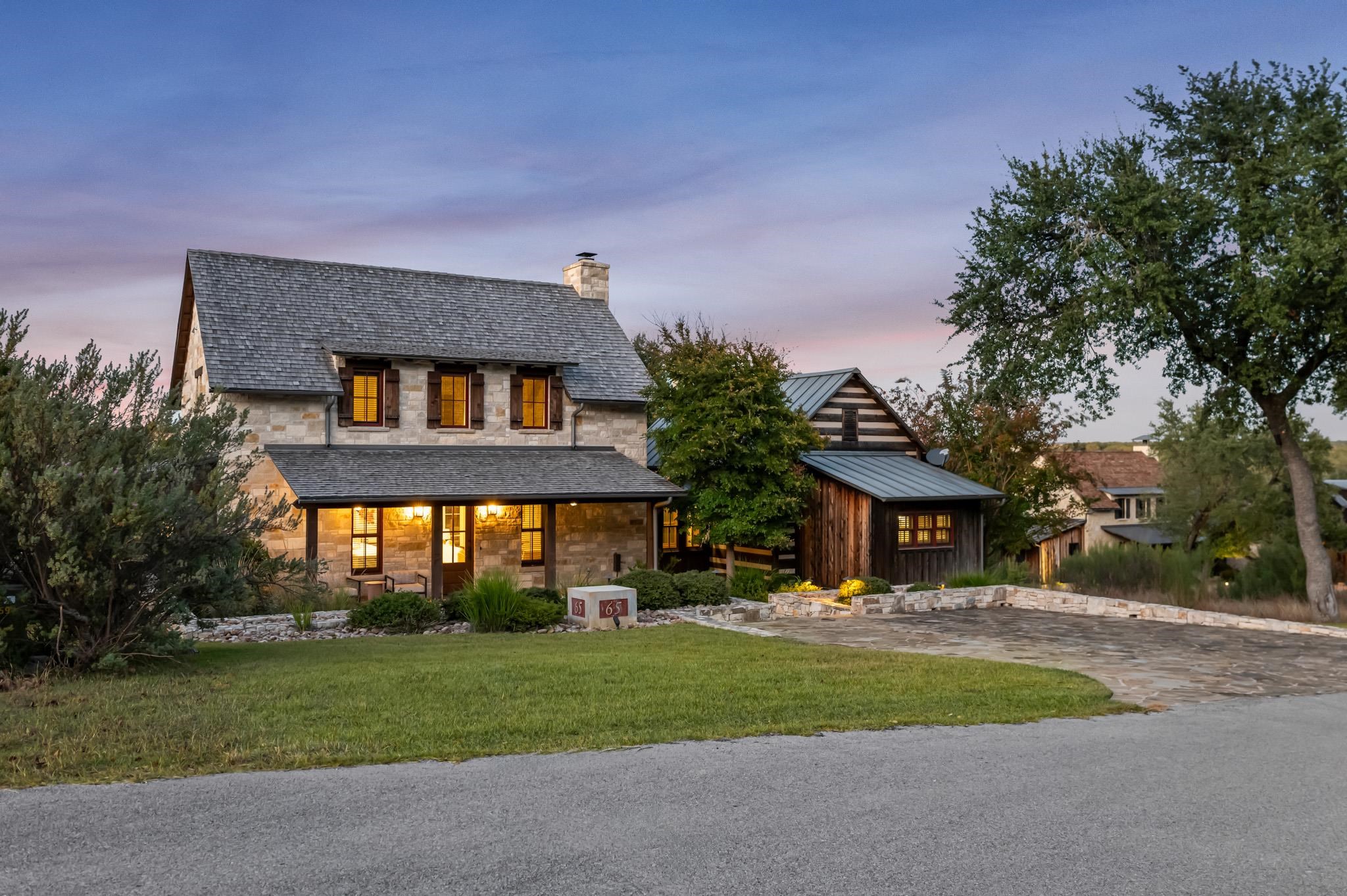 65 Riviera Cove Fredericksburg, TX 78624 - Photo 2 of 26 a front view of a house with a yard