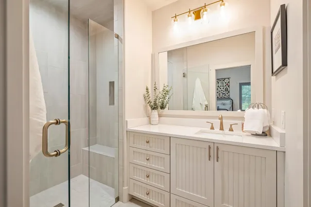a bathroom with a double vanity sink mirror and double