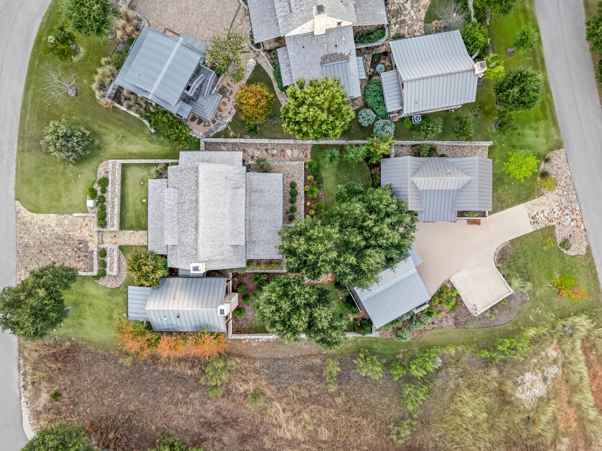 65 Riviera Cove Fredericksburg, TX 78624 - Photo 25 of 26 an aerial view of residential house with outdoor space and lake view