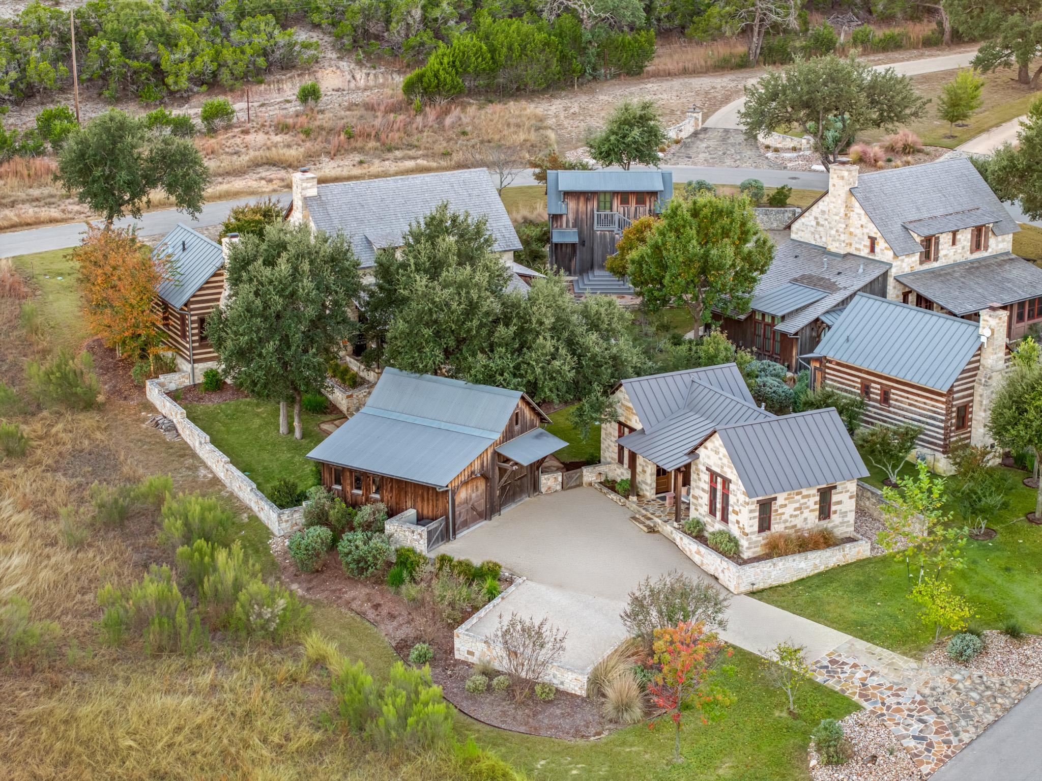 65 Riviera Cove Fredericksburg, TX 78624 - Photo 26 of 26 an aerial view of a house with garden space and street view
