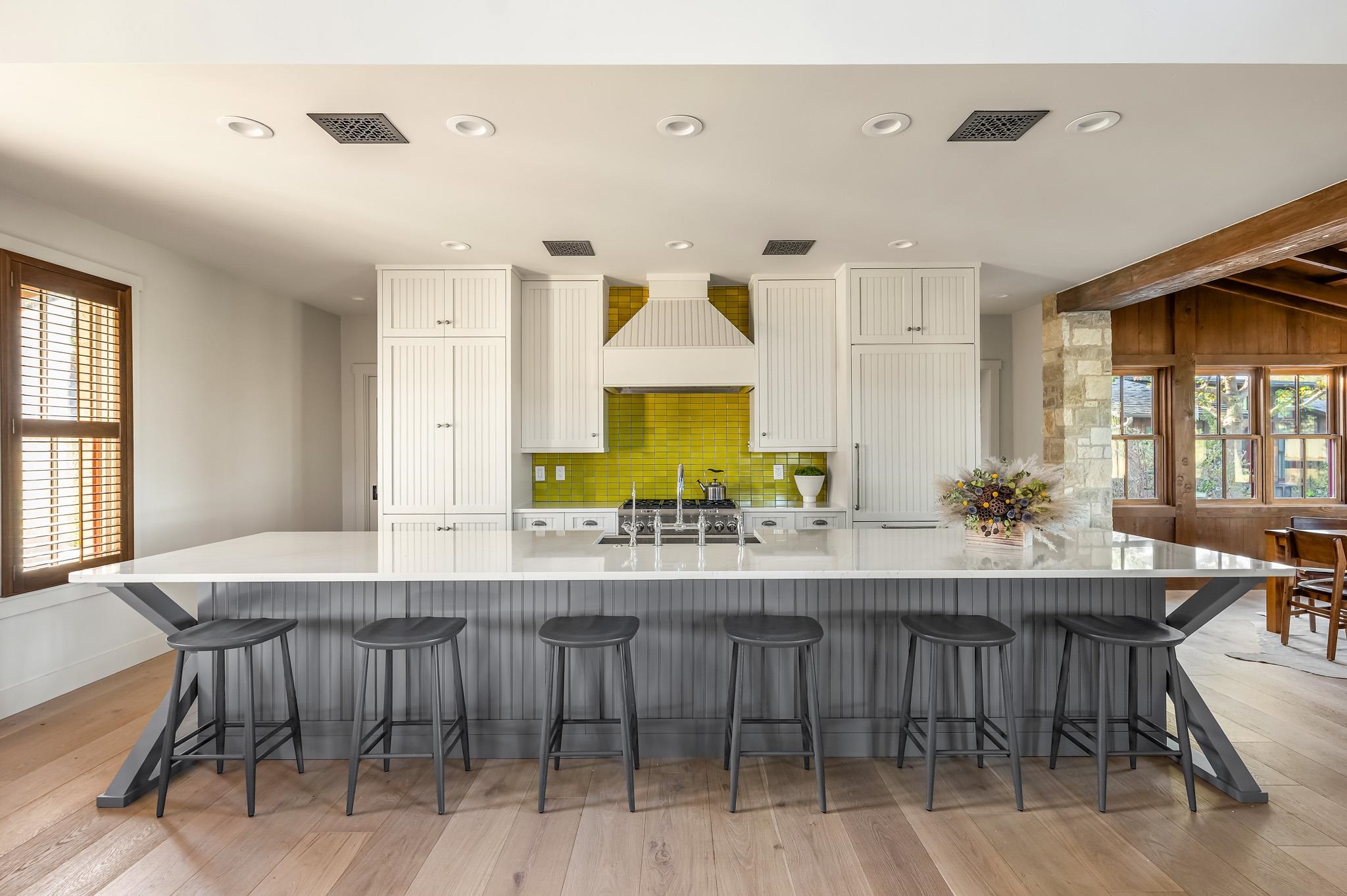 65 Riviera Cove Fredericksburg, TX 78624 - Photo 6 of 26 a dining hall with stainless steel appliances granite countertop a dining table and chairs