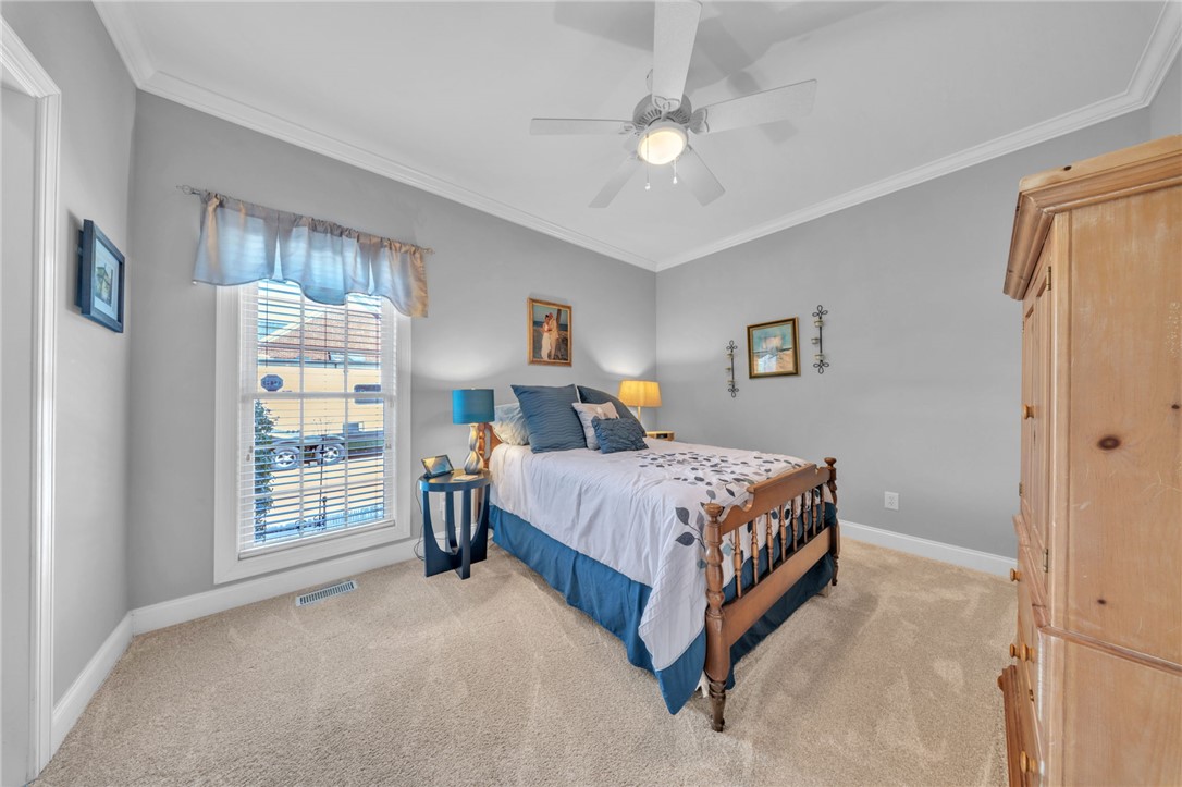 648 Mountain View Road Williamston, SC 29697 - Photo 25 of 42 Well-lit room with plush carpeting and a classic ceiling fan provides a comfortable personal retreat.
