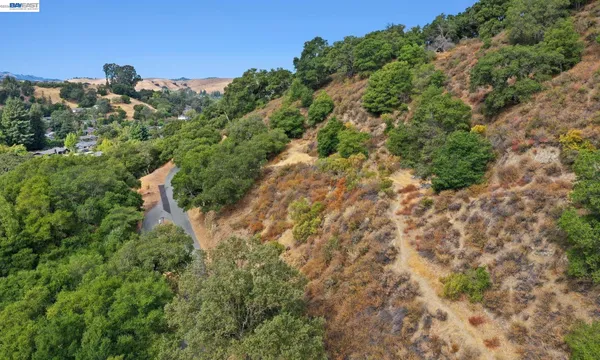 a aerial view of a house with a yard