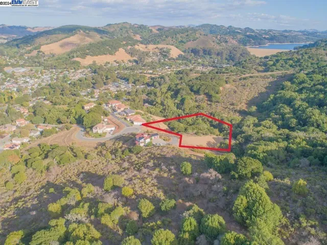 an aerial view of houses with yard