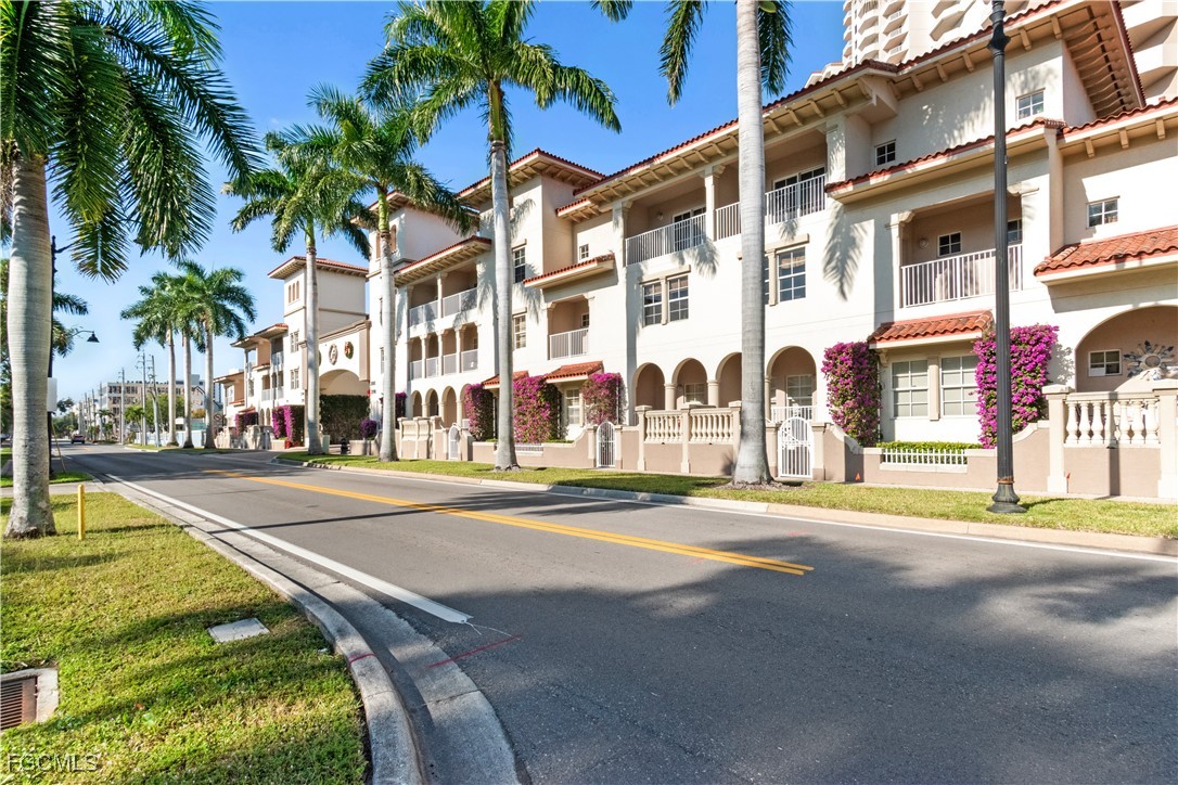 a city street lined with buildings and trees